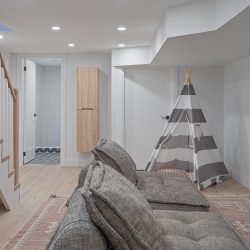 Recreational room with couch and child's play tent