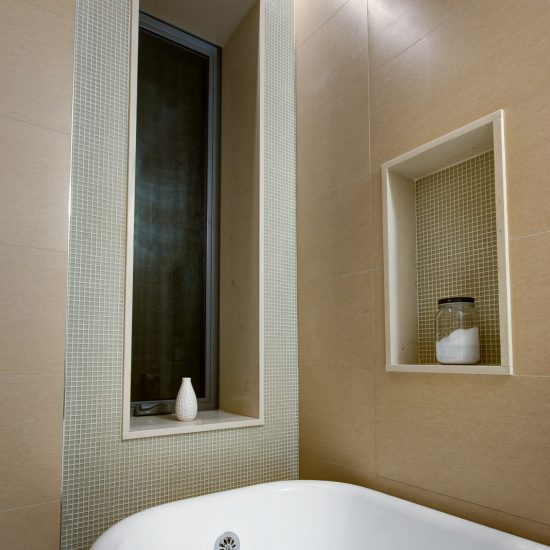 Close up view of bathtub and window